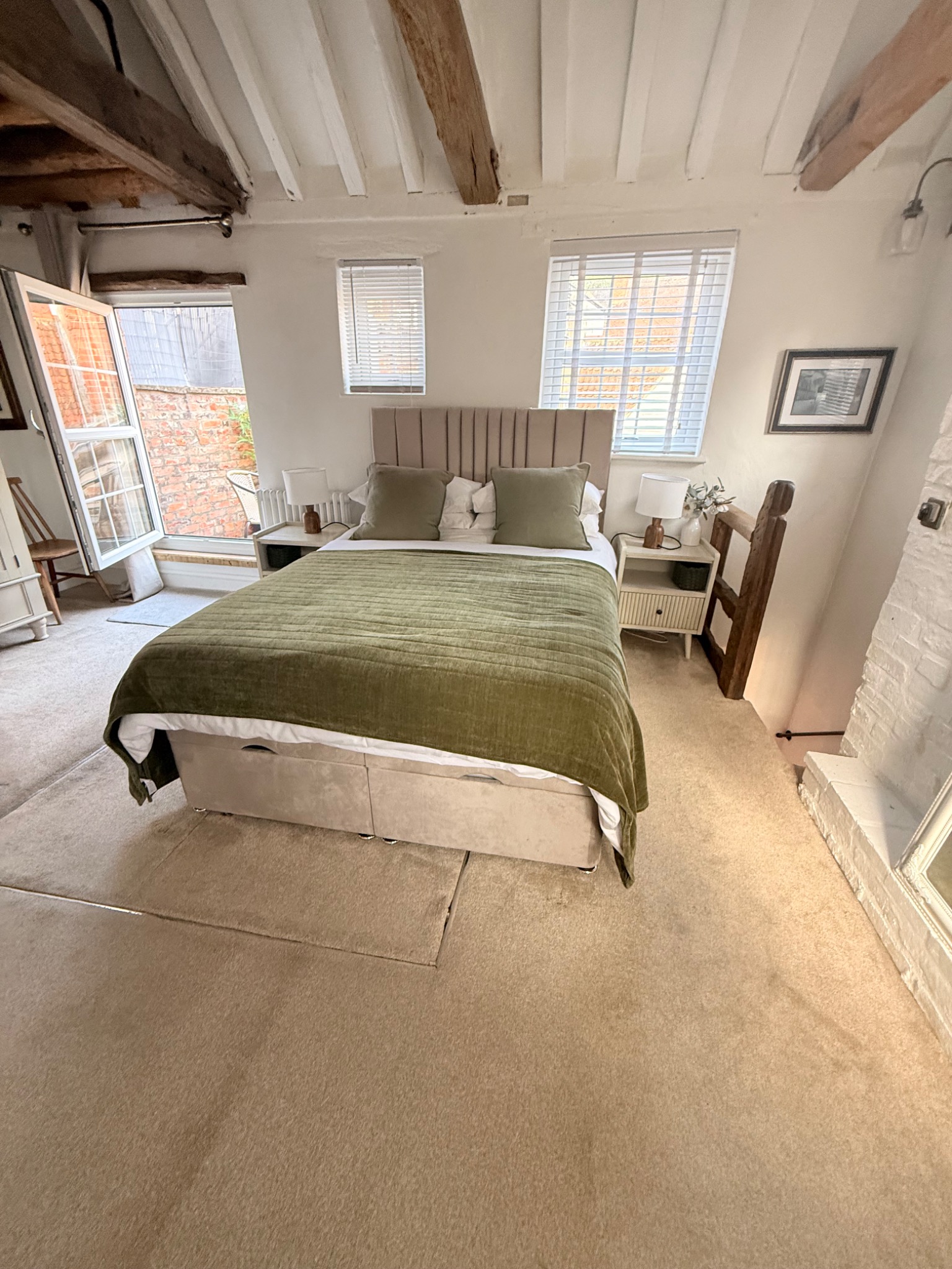 The Nook bedroom with its open door to the balcony